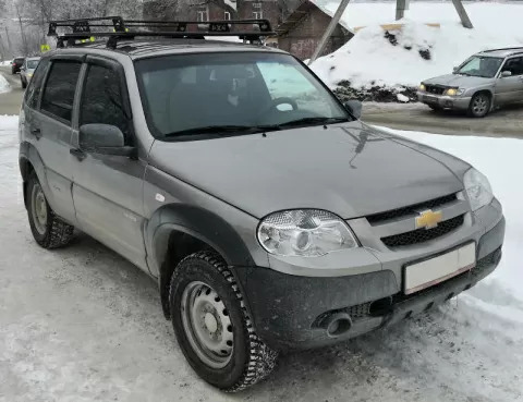 Багажник экспедиционный УНИКАР для ВАЗ-2123 Chevrolet Niva, LADA Niva Travel с ограждением и сеткой в штатные места фото 3
